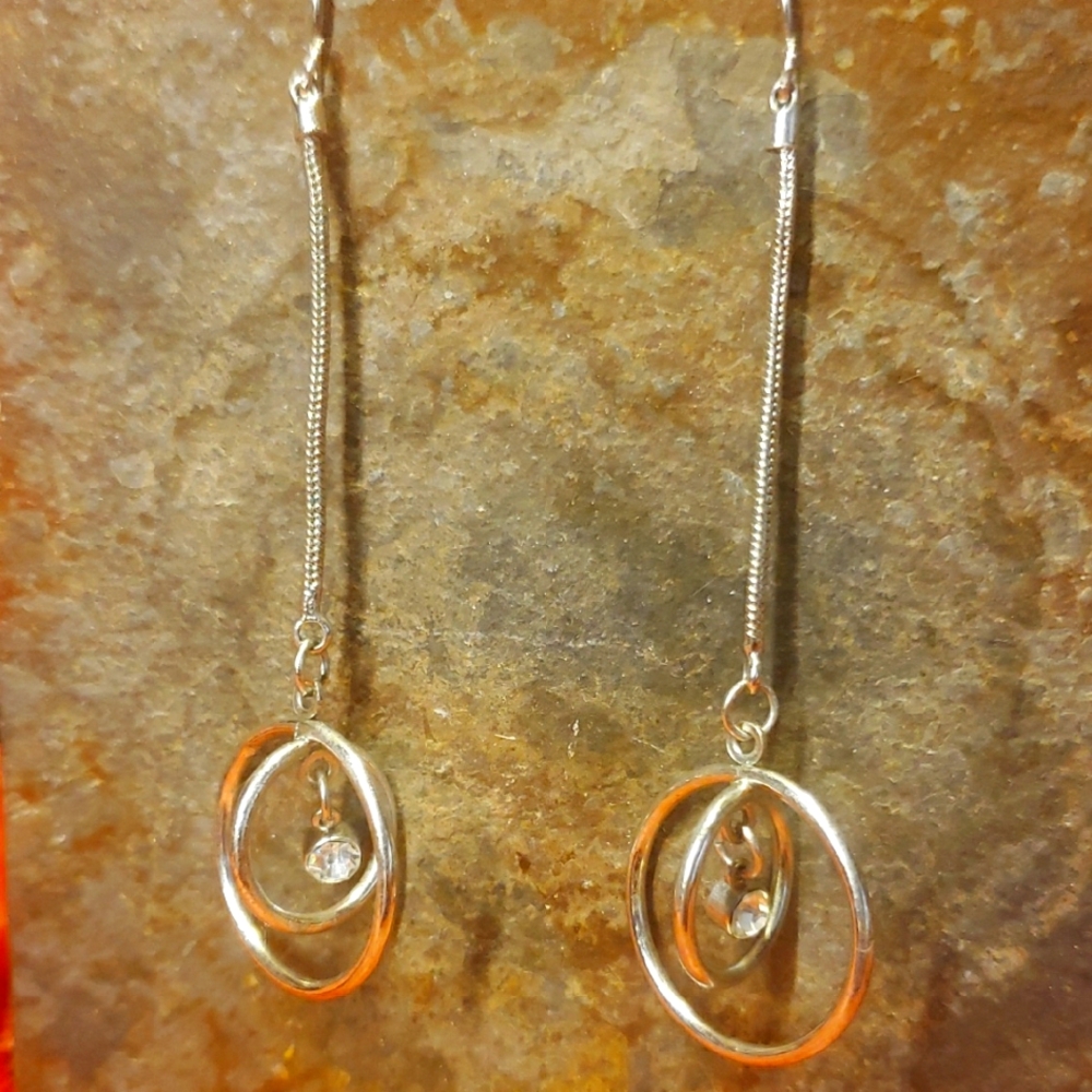 Elegant Silver Dangle Earrings With A Zubic